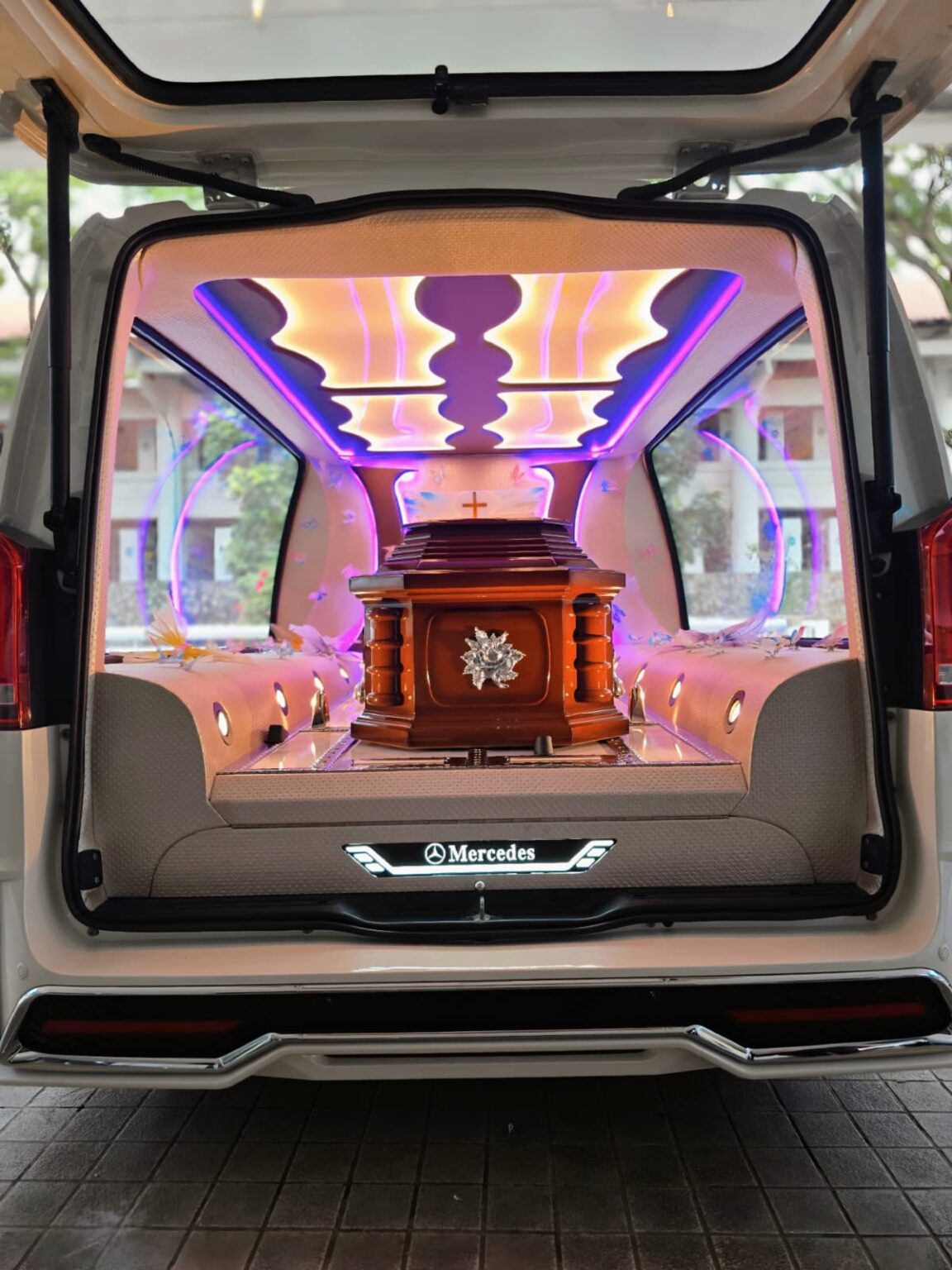 Catholic 7 Catholic Casket in a hearse