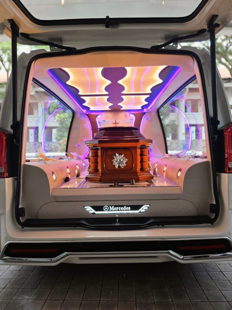 Catholic Casket in a hearse